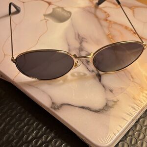 Gold and Black Oval Sunglasses